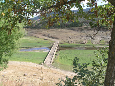 Dried up reservoir bed, with old bridge now visable